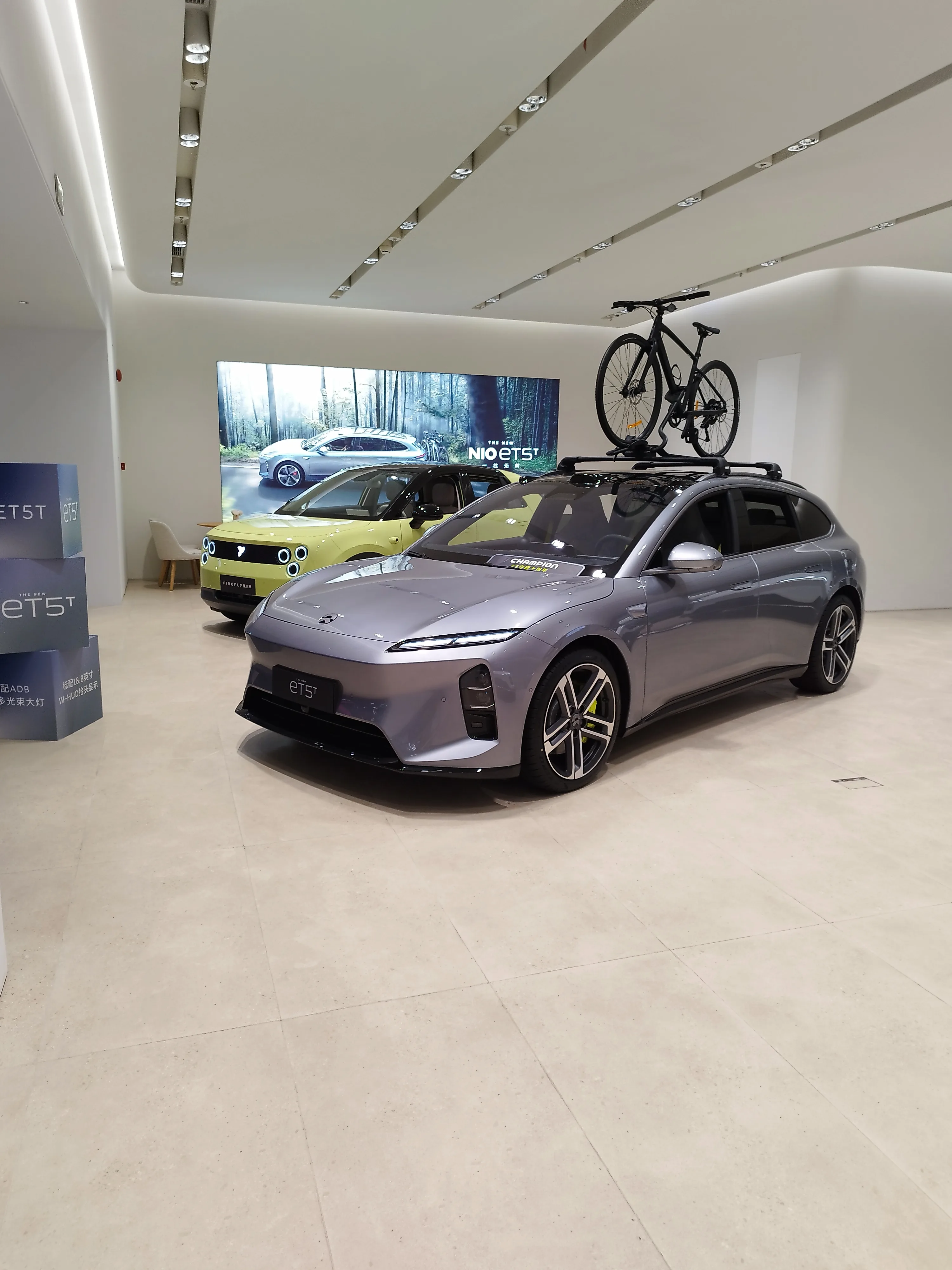 Nio ET5T in grey with bicycle on roof rack