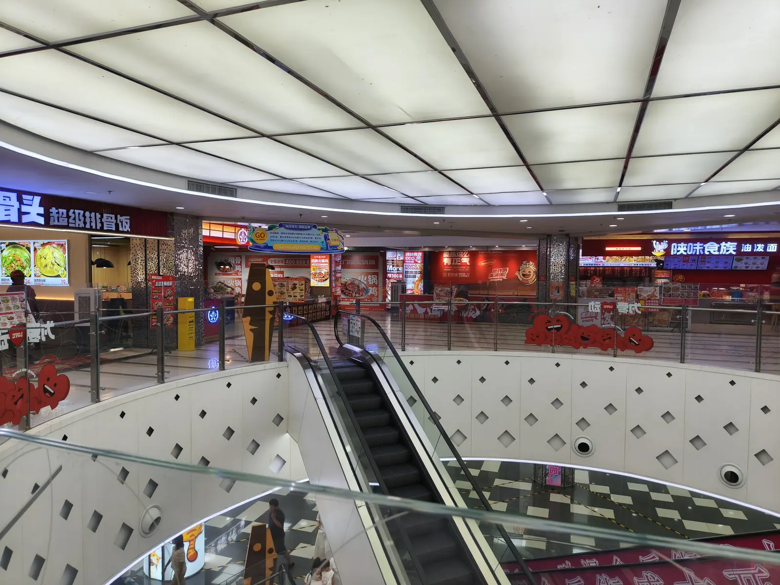 Different independent restaurants side by side on a mall's top floor
