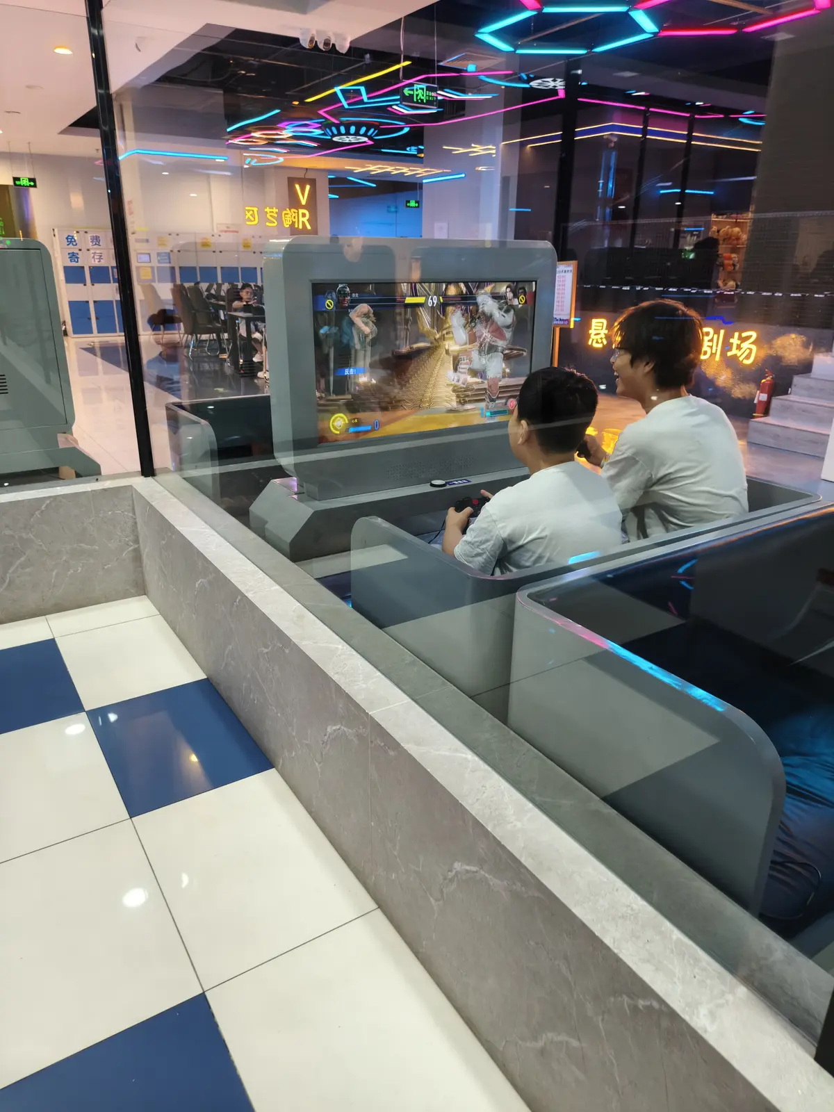 Private PlayStation booths with lounge sofas in a Chinese mall