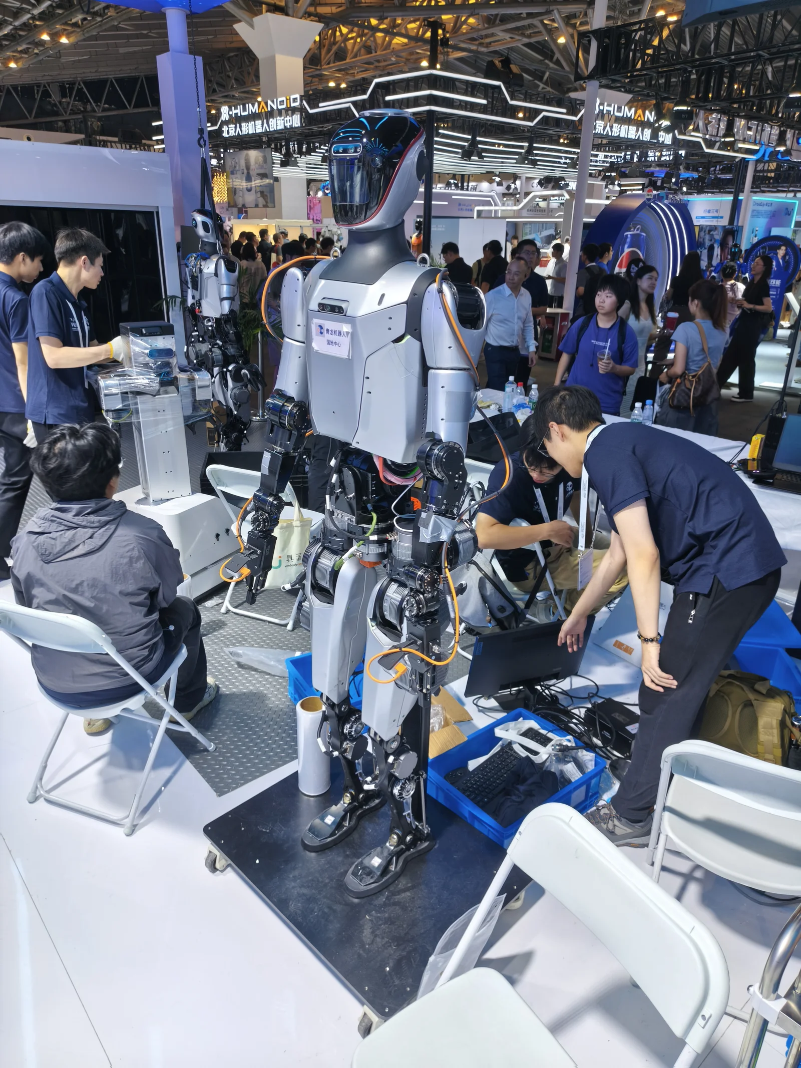 Humanoid robot being calibrated at WAIC 2025